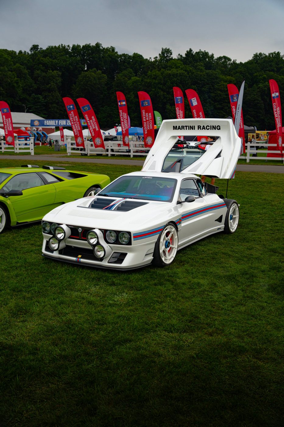 White Martini-livery race car with gullwing rear at a car show